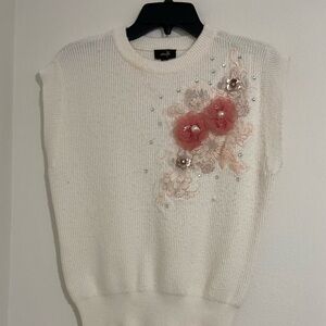 Elegant White Sleeveless Top with Floral Accents